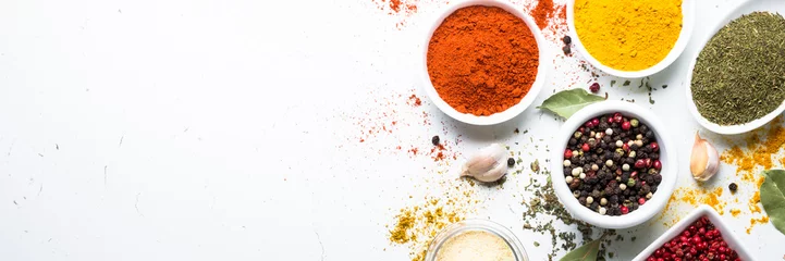 Foto op Canvas Set of spices in a bowls on white background. © nadianb