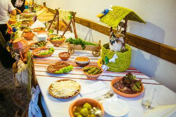 Table with salty snacks served in ethnic style