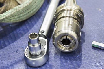 The block wrench with the equipment and holder on the rubber floor