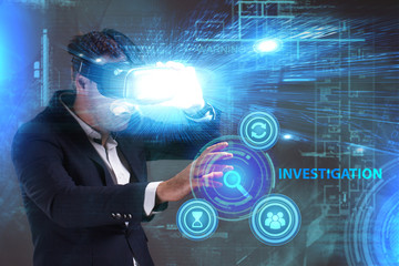 Business, Technology, Internet and network concept. Young businessman working in virtual reality glasses sees the inscription: Investigation