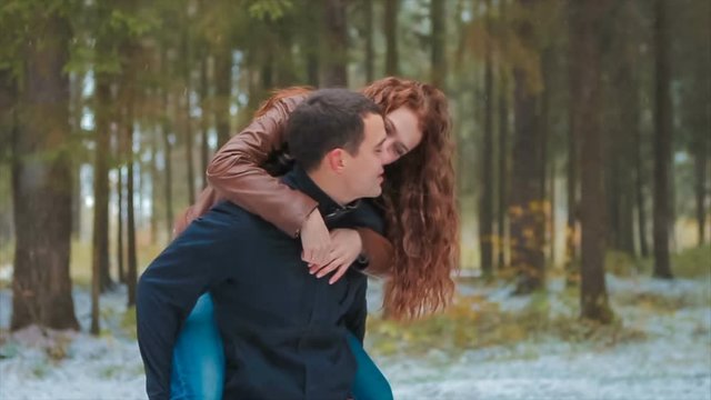 Woman Riding on Her Boyfriend's Back