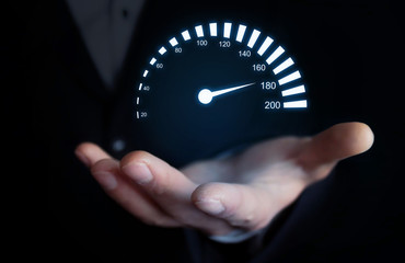 Man holding car speedometer. Speed concept.
