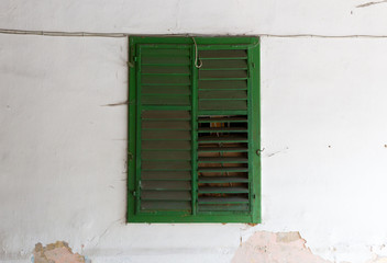 Green shutte, old wall