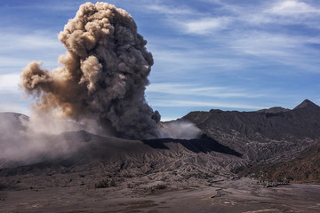Fototapeta na wymiar Ash coming from crater of active volcano Mt Bromo during eruption in January 2016, Indonesia