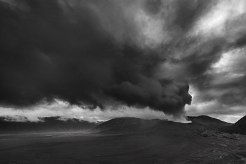 volcanic ash erupting from Mt Bromo volcano covering the whole sky
