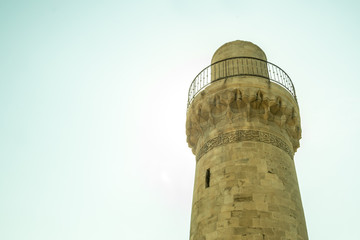 An old mosque minaret Azerbaijan old town.