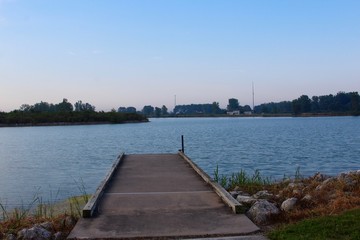 The wood dock and the lake in the park.