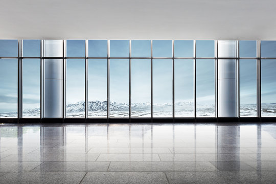 Empty Office With Snow Mountains Out Of Window