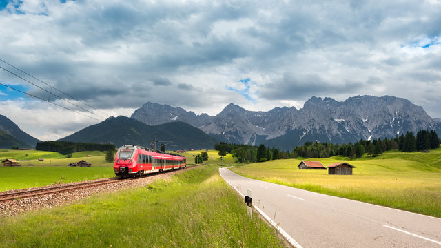 Karwendel Panorama with modern train near Mittenwald, Bavaria, Germany