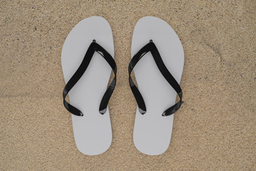 3d rendering slippers isolated on sand background mock-up