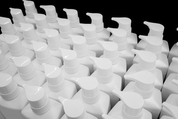 Obraz premium Round white plastic bottle with dispenser pump for liquid soap, shampoo, shower gel, lotion, body milk