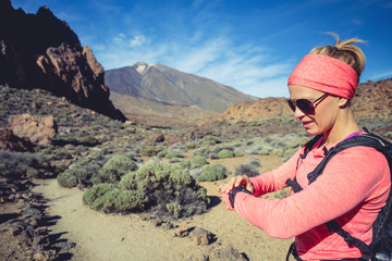 Runner looking at sport watch checking performance