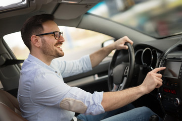 Man Using Gps Navigation System In Car to travel