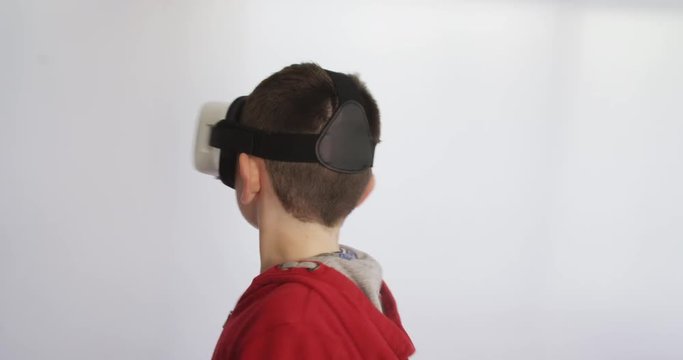 Young boy watching a 360 video when wearing a VR headset