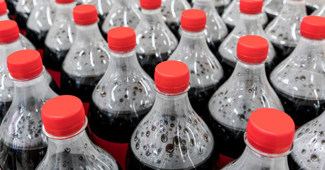 plastic bottles with carbonated soft drinks