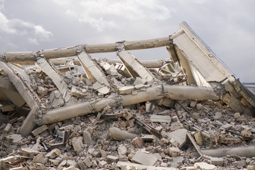 Damaged house with stormy clouds above