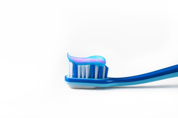 toothbrush and blue toothpaste
