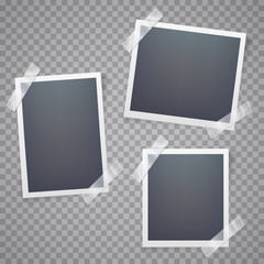 Collection of blank photo frames with adhesive tape.