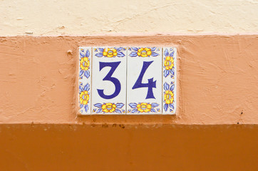 number thirty four on a colourful wall