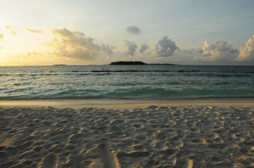 Sunrise or Sunset on a beautiful beach with golden sands in the Maldives