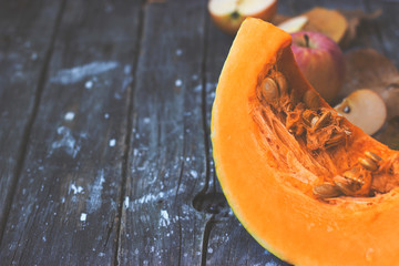 Pumpkin slice on wooden background