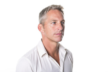 Portrait of confident mature man standing on white background