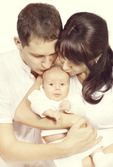 Fototapeta na wymiar Family Kiss Newborn Baby, Mother and Father Kissing New Born Child, Kid One Month Old