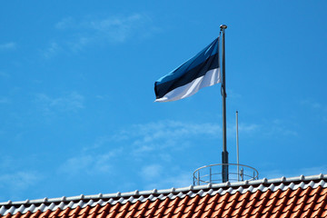 Estonian flag on Tall Hermann Tower in Old Town of Tallinn, Estonia
