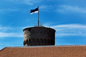 Estonian flag on Tall Hermann Tower in the Old Town of Tallinn, Estonia