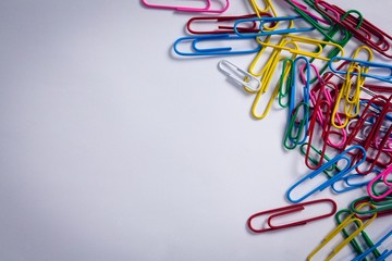Various paper clips on white background