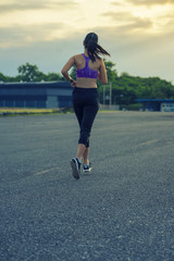 Women are jogging in the evening.