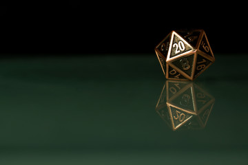 A polyhedral twenty sided die used for role playing games such as Dungeons & Dragons.