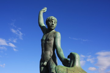 Fototapeta na wymiar Lake Zurich with famous Ganymede Statue in Zurich, Switzerland
