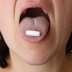 woman taking pill