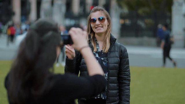 Girl poses for a photo in London in slow motion
