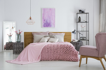 Knit blanket in feminine bedroom - obrazy, fototapety, plakaty