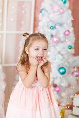 Cute girl in a Christmas decorations