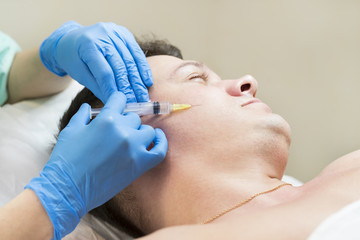 Man passes a course of mesotherapy clinic 