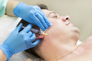 Man passes a course of mesotherapy clinic 
