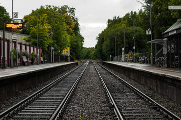 Fototapeta na wymiar Follow the railway tracks in the forrest