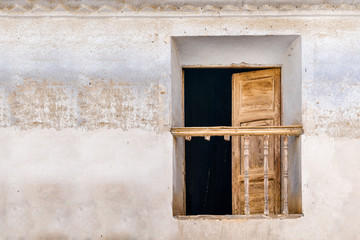 Fototapeta na wymiar broken window in an old rustic house