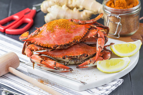 Maryland blue crabs with seafood utensils