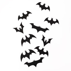Halloween handmade black bats on white background. Flat lay, top view.