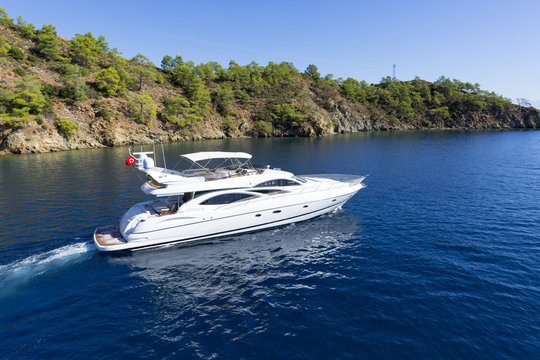 Fototapeta Luxury private motor yacht sailing at sea