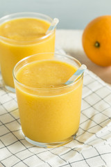 Fototapeta na wymiar Sweet Homemade Orange Smoothie Milkshake