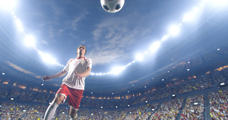 Soccer player kicks the ball on the soccer stadium. He wear unbranded sports clothes. Stadium and crowd made in 3D.