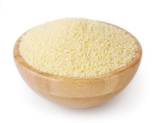 Uncooked couscous in wooden bowl isolated on white background with clipping path