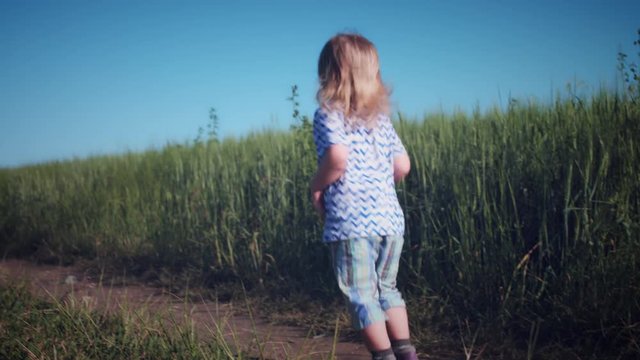 4k Child Jumping Happy in Wheat Fields