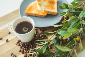 Coffee and breakfast, coffee beans around on the table