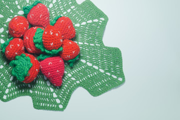 Handmade knitting wool berries isolated on white background